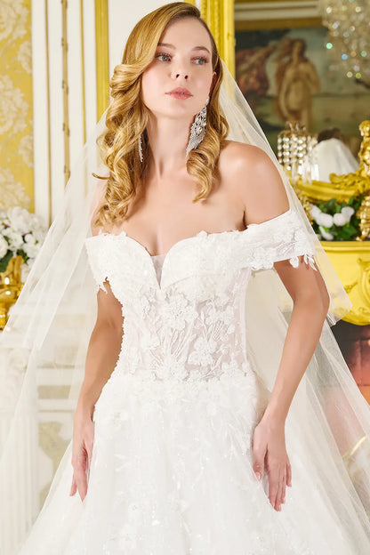 Woman in a white wedding dress with a veil in an elegant interior setting