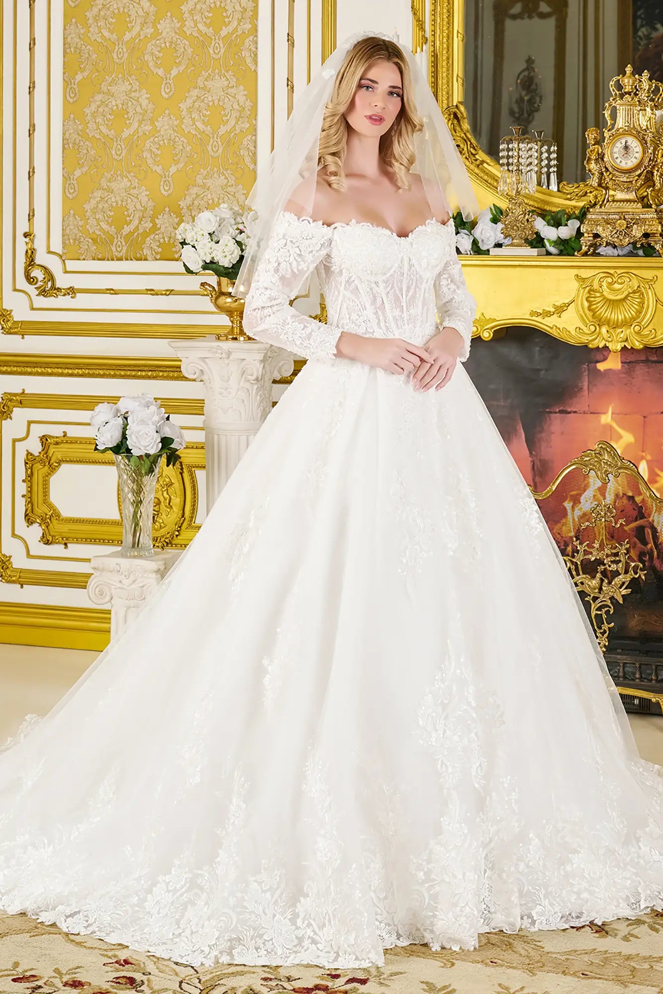 Woman in a white wedding dress standing in an ornate room with gold accents.