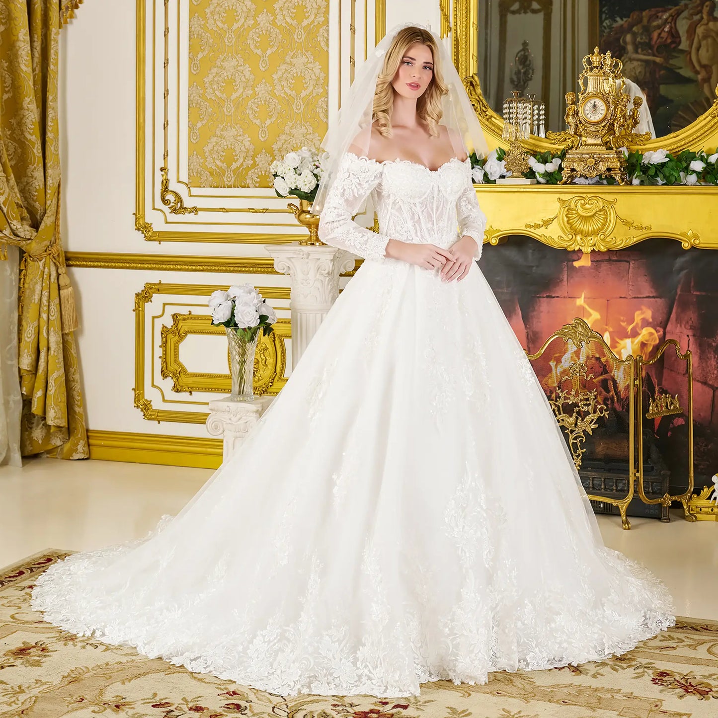 Woman in a white wedding dress standing in an ornate room with gold accents.