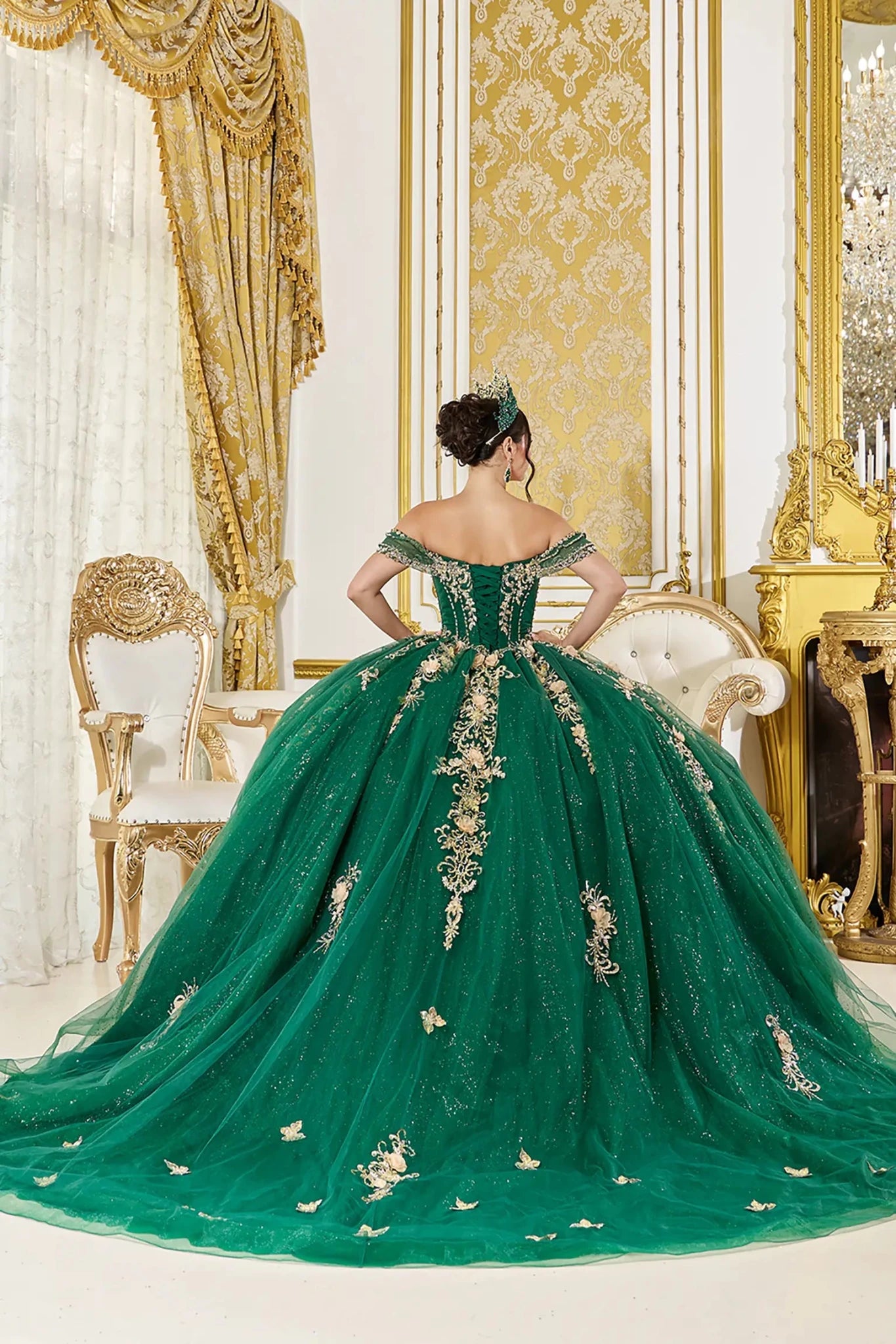 Hunter green quinceanera ball gown back view showing lace up corset back, embellished tulle skirt, and dramatic cathedral length train