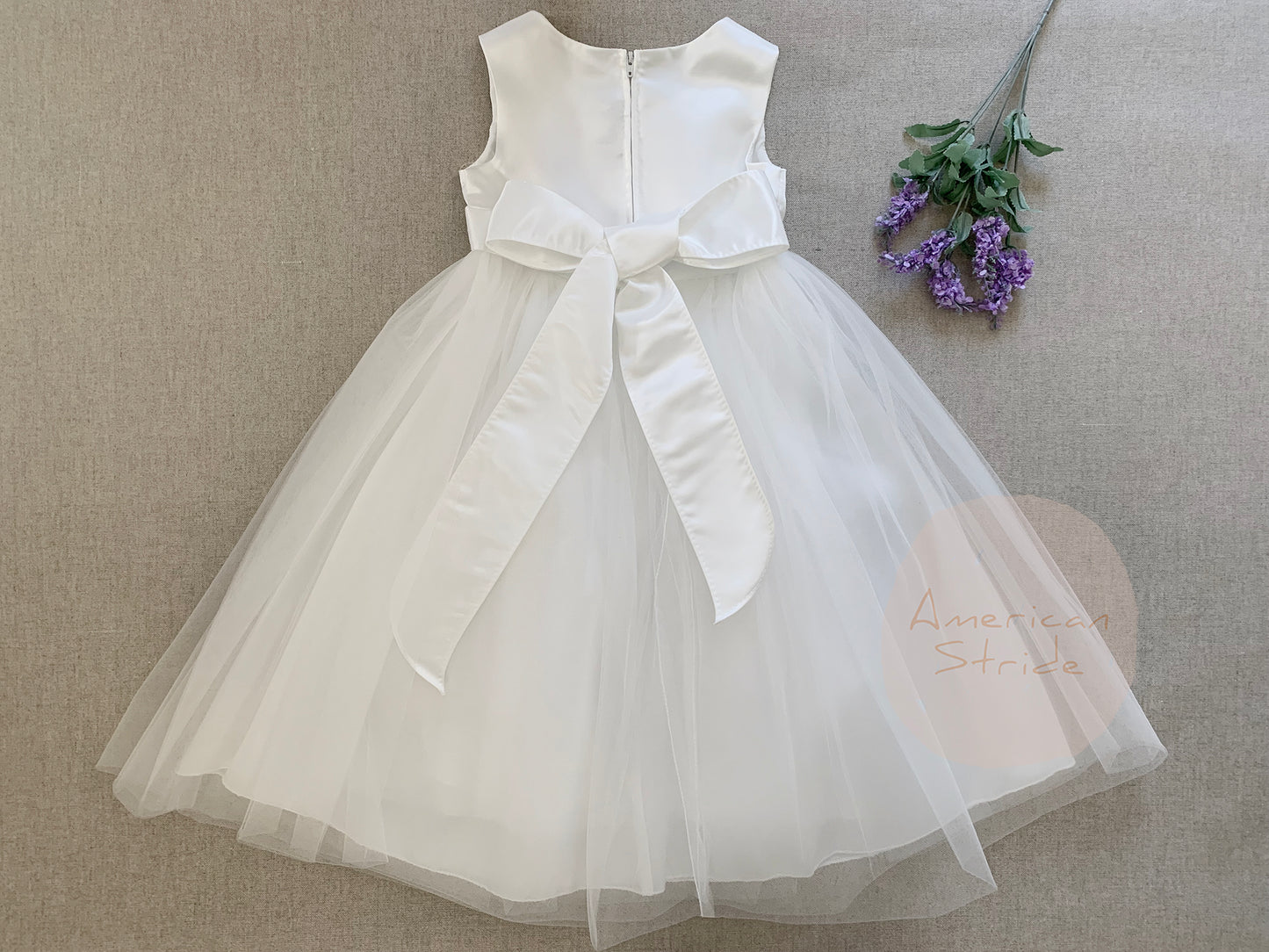 USA Made | Dainty Rhinestone Flower Girl Dress | Classic Satin and Tulle Flower Girl Dress | Size 6M - Teen - back of dress with flowers next to dress.