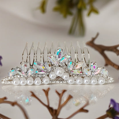Decorative hair comb with pearls and crystals on a decorative surface