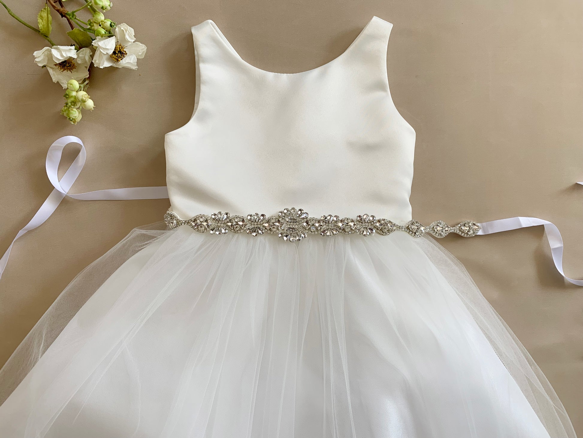 Flower Girl Dress with a detachable Rhinestone belt - view of front of dress with a flower on the left side of dress