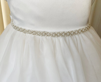 Off White dress with a decorative belt on a mannequin