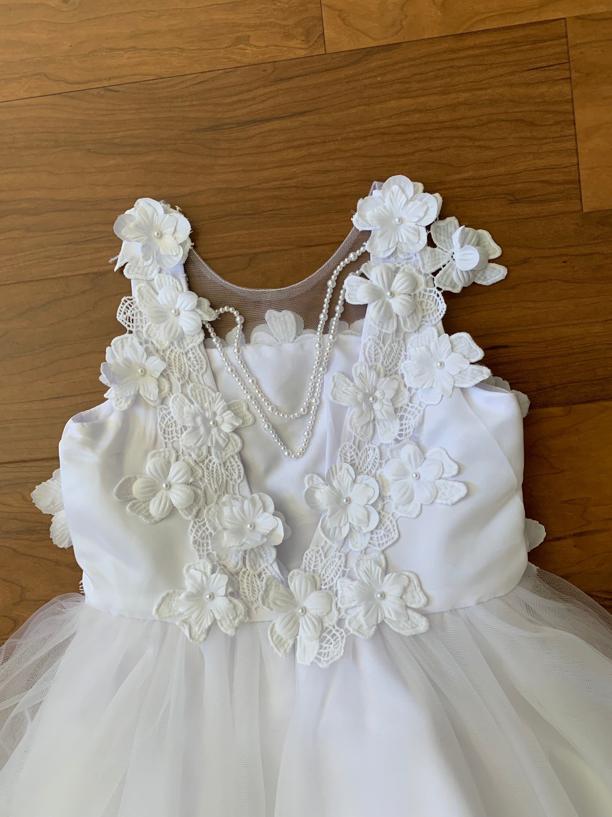 White High-Low Tulle Dress with 3D Flower Lace Top Accentuated with Pearl Trim Flower Girl Dress | Flower Girl Dress - zoomed in view of top of dress