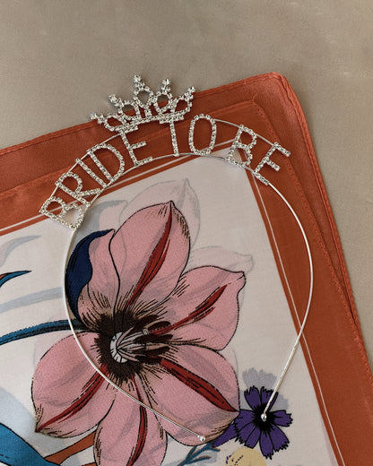 head band with 'Bride to Be' rhinestone text on a flower pattern fabric