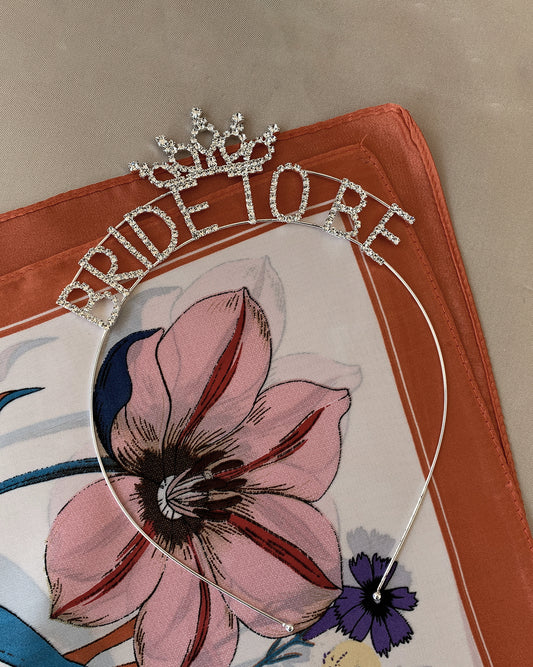 head band with 'Bride to Be' rhinestone text on a flower pattern fabric