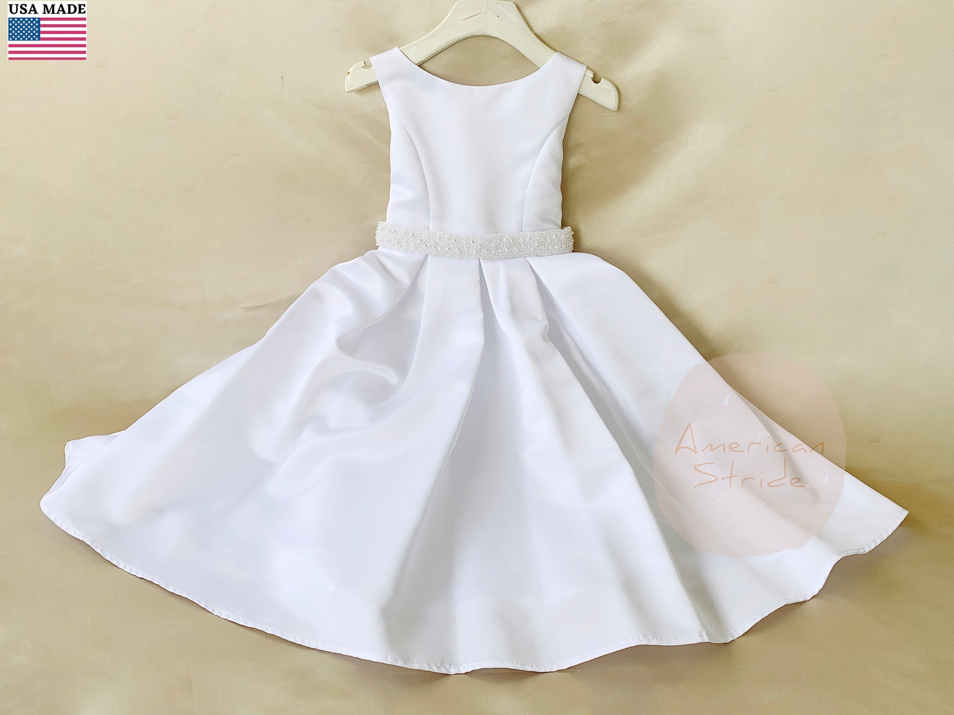 USA Made | Fully Satin Flower Girl Dress w/ Detachable Handmade Pearl belt | Baptism blessing dress - front view of dress on hanger with pearl belt/sash