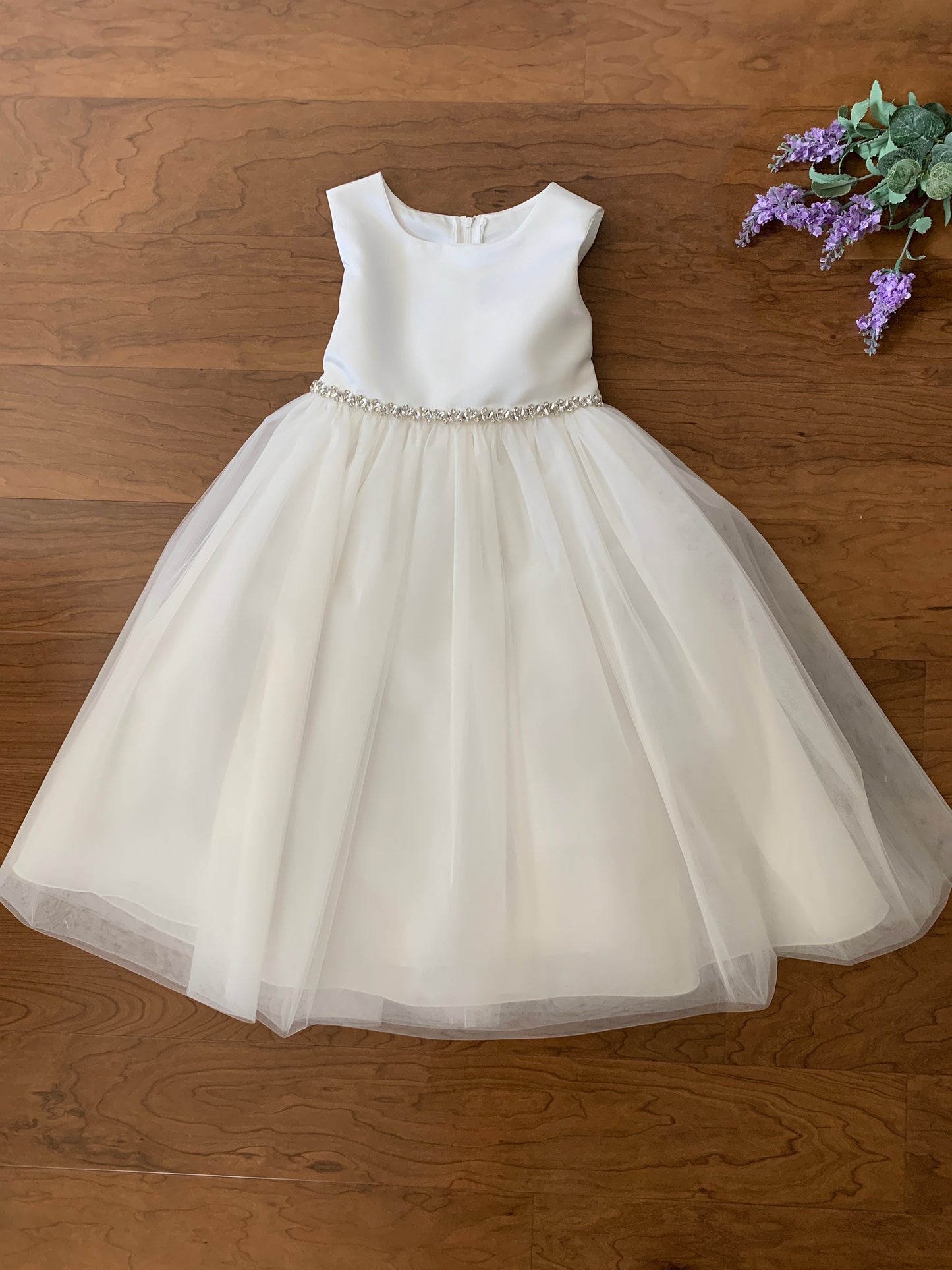 USA Made | Dainty Rhinestone Flower Girl Dress | Classic Satin and Tulle Flower Girl Dress | Size 6M - Teen - full front view of dress with purple flowers next to dress