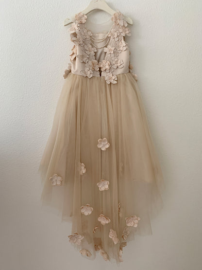 Champagne High-Low Tulle Dress with 3D Flower Lace Top Accentuated with Pearl Trim Flower Girl Dress | Flower Girl Dress - back view of dress on hanger