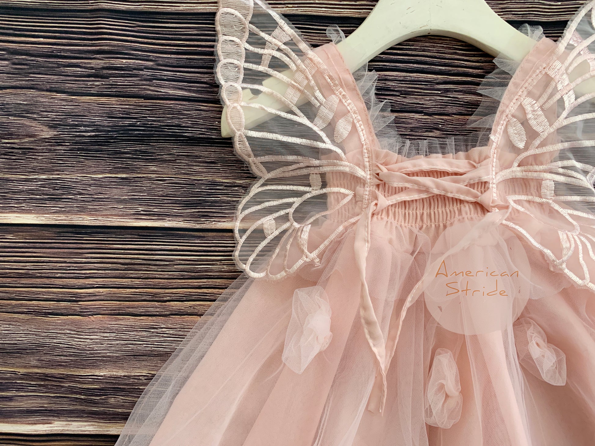 Baby Blush Butterfly Wings Lace Tulle Dress | Baby Special Occasion Dress I Flower Girl Dress - front view of dress on hanger