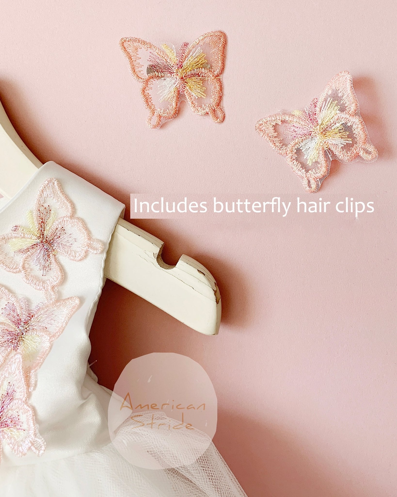 butterfly hair clips on a pink background