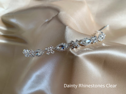 Silver hair vine with clear rhinestones on beige satin fabric