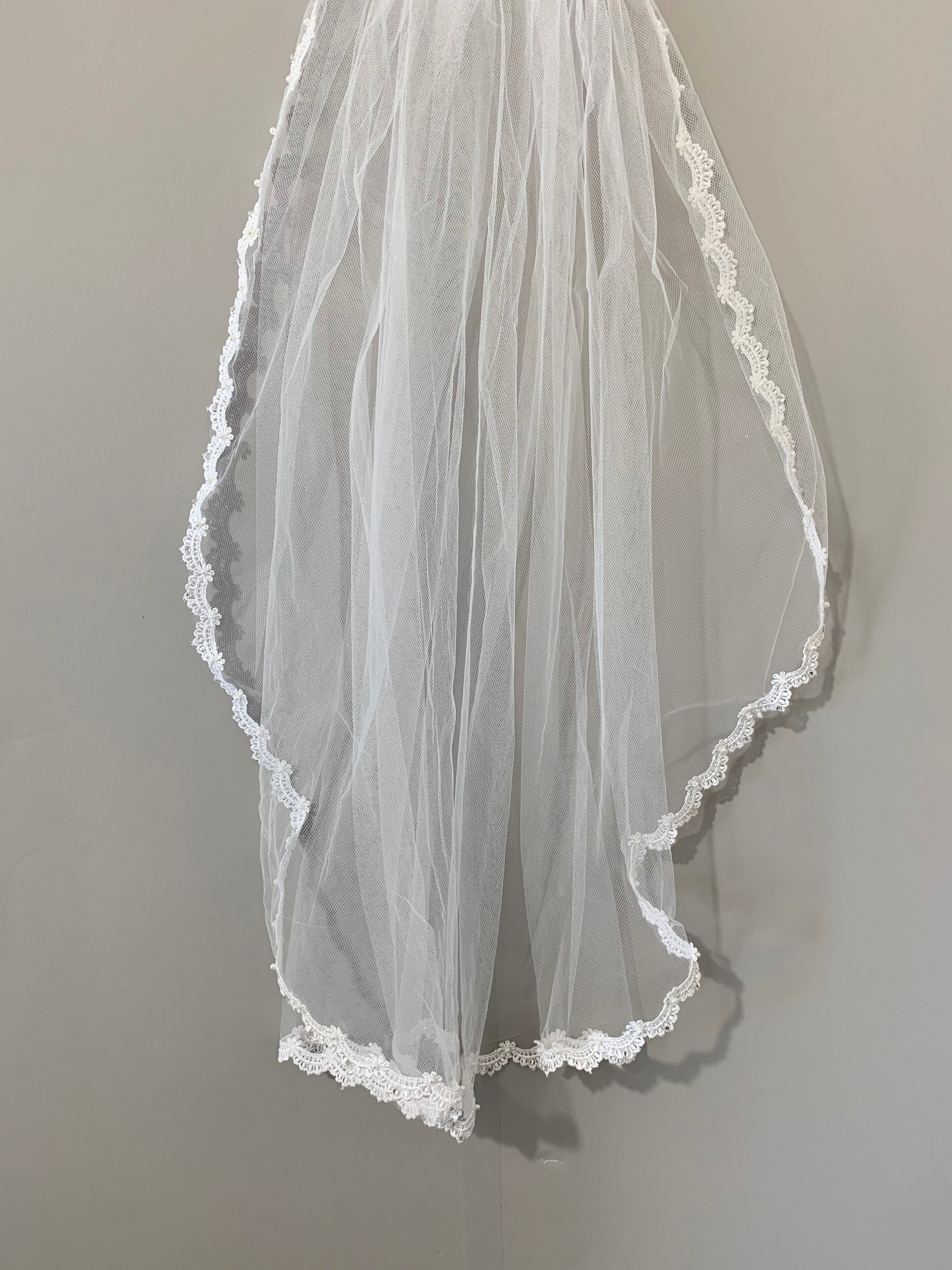 USA Made | Handmade Flower Girl Lace Rhinestone and Pearl Veil | Communion Lace Rhinestone Veil on wall