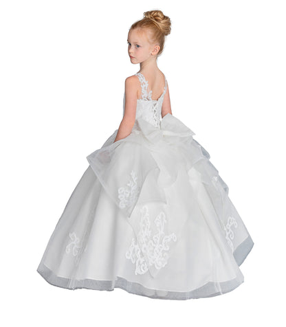 Young girl wearing a white floral dress on a white background