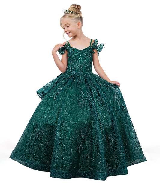 Young girl wearing a green sparkly dress on a white background