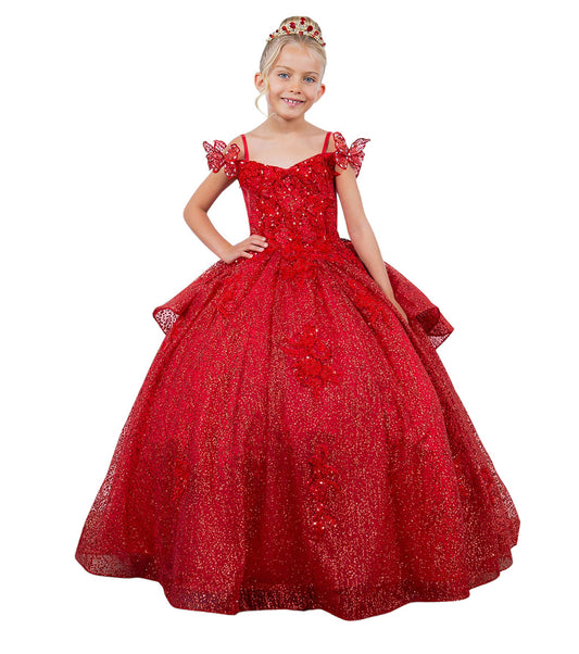 Young girl wearing a red sparkly dress on a white background