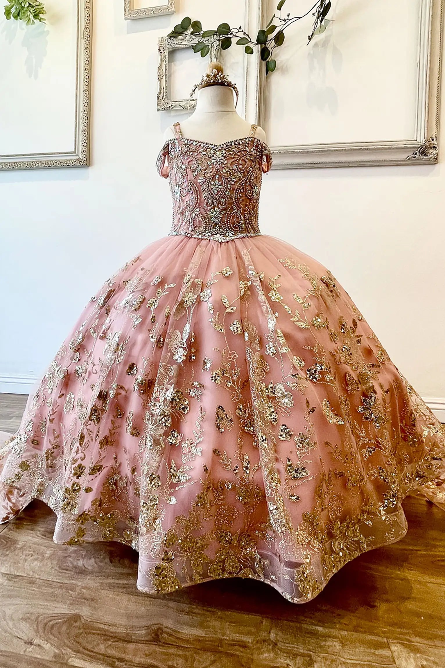 Rose gold kids mini quinceañera dress with stone and gem-embellished bodice, glitter tulle skirt, and detachable long train