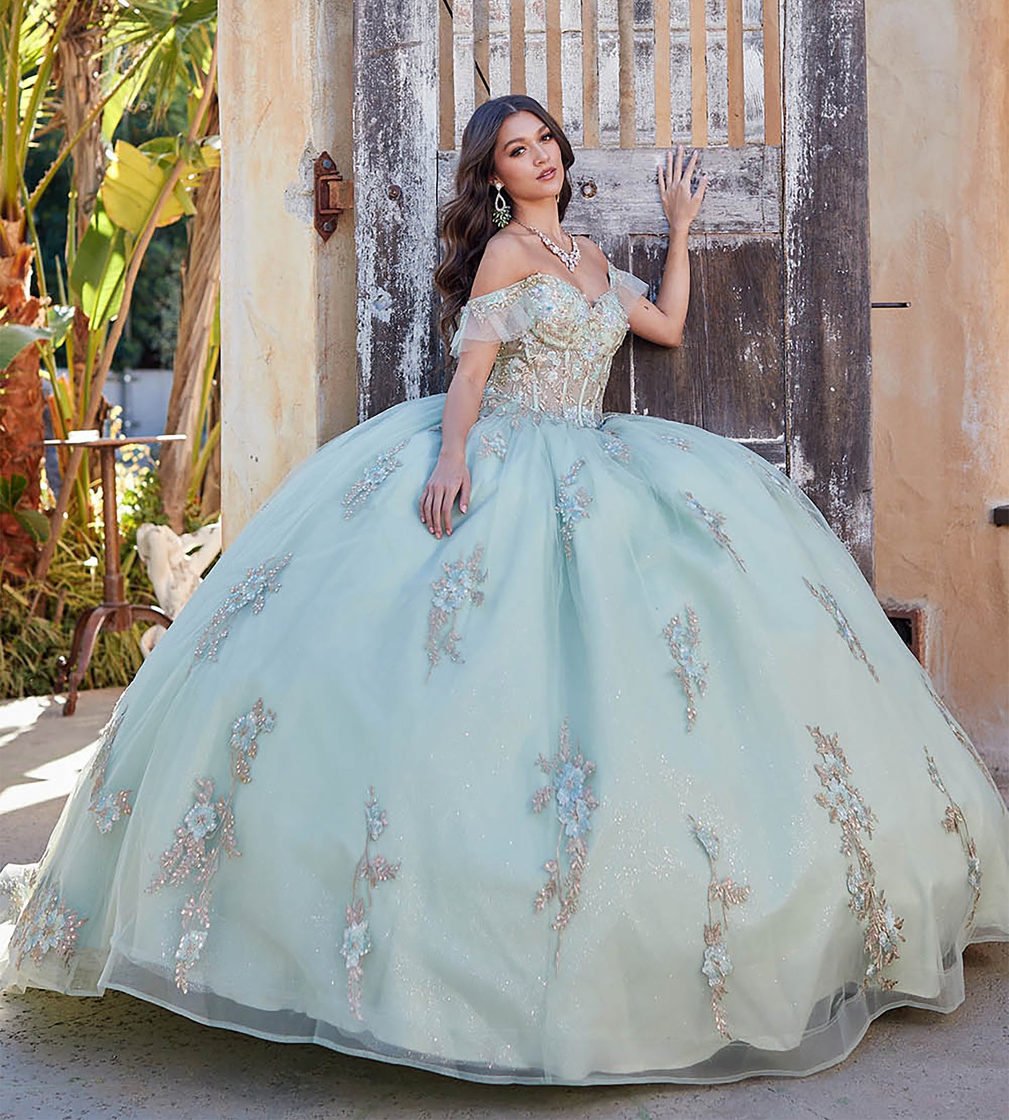 Quinceañera | Sage with Gold Embroidery Detail Bodice Sweet 15 Ball Gown with Detachable Sleeves | Claudia dress side with a girl