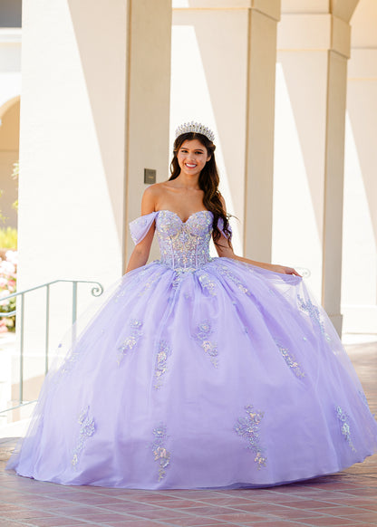 Quinceanera | Lilac Two-Tone See-Through Shimmering Sequins and 3D flowers Bodice Ballgown - front view of woman wearing dress smiling into camera