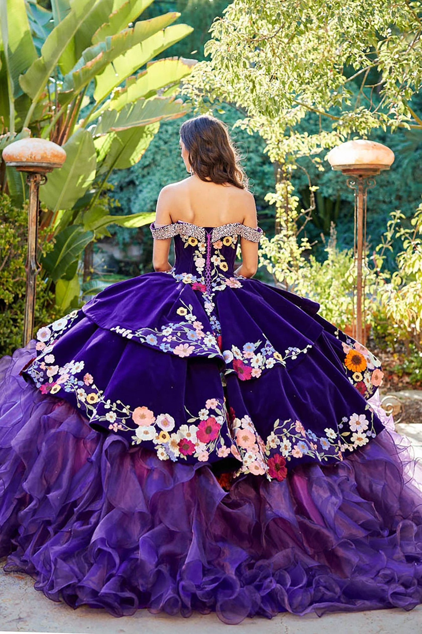 Quinceañera | Purple Charro Multi Colored Gem detail Floral Velvet with Organza Ruffled overlays Ballgown | Ainara dress back view