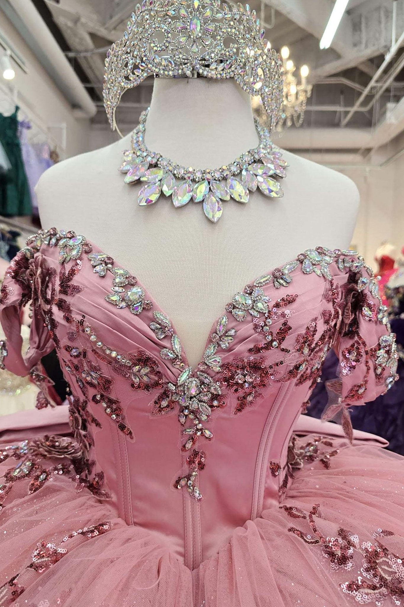close up of the top part of the dress showing a big beautiful gem stones