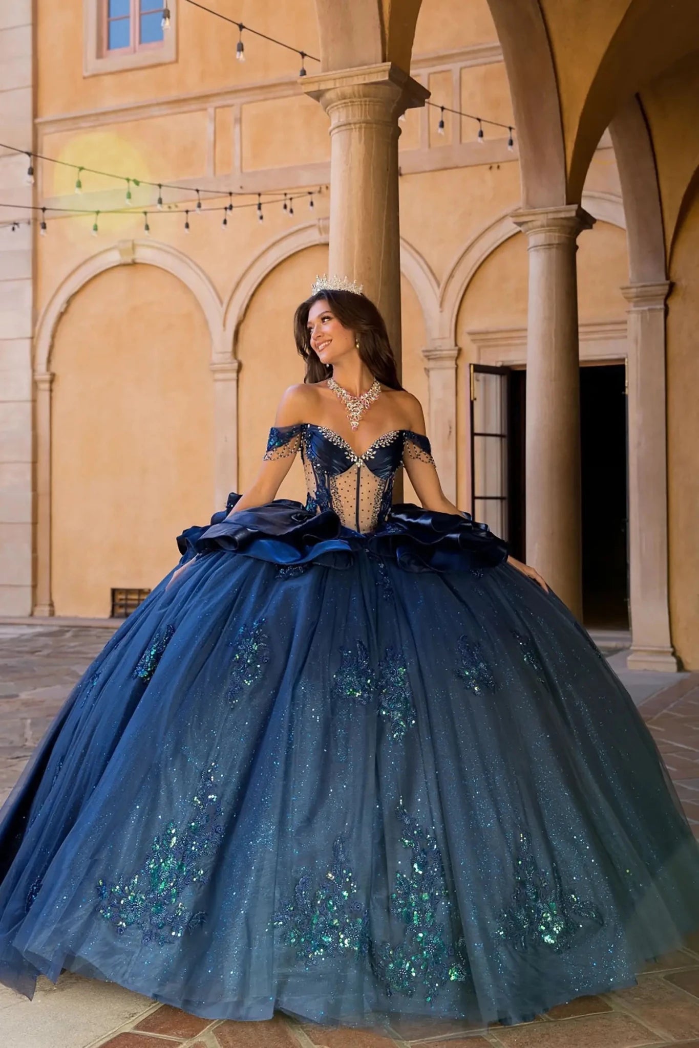navy quinceanera ball gown with 3d floral embroidery and ruffled overlays