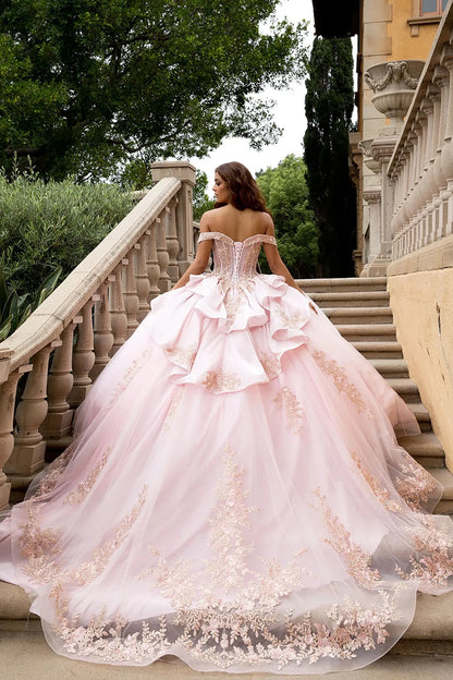 Back view Posed on a grand stone staircase with a classical villa background, the image highlights the massive scale of the glitter tulle ball gown skirt and the intricate rose gold floral lace embroidery cascading toward the hem.
