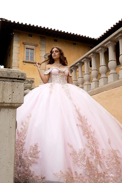 he model is wearing a matching rhinestone statement necklace, set against a luxurious architectural backdrop with classical balustrades.