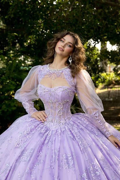 Front zoom view of a woman wearing a lilac quinceañera dress with glitter tulle skirt and matching bolero jacket