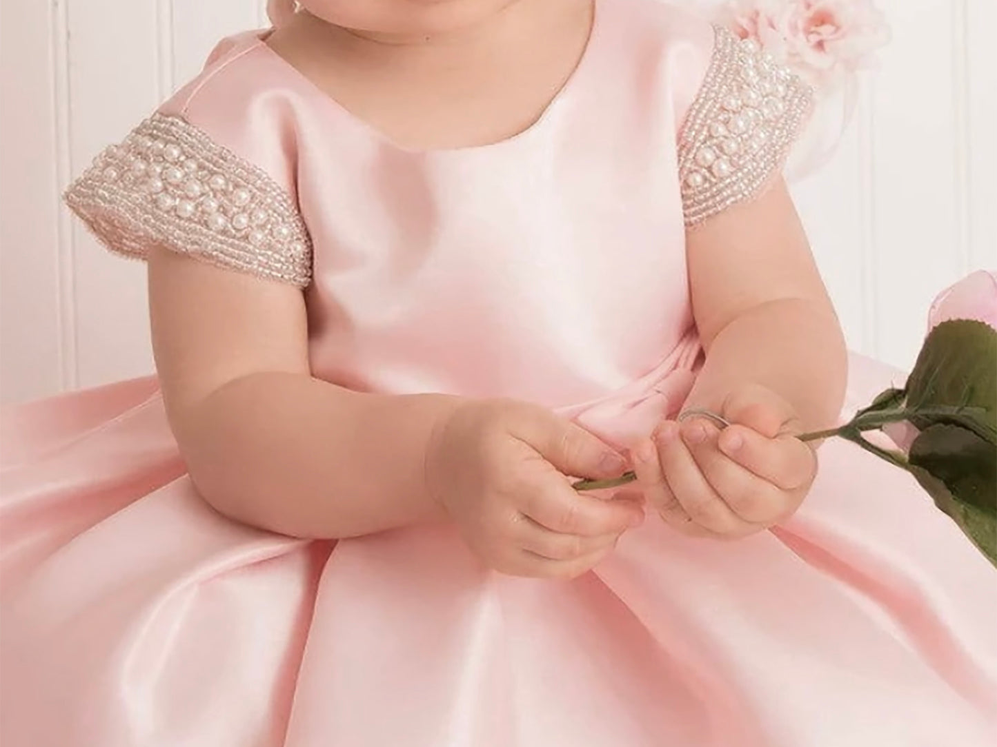 Blush Flower Girl Beaded Short Sleeves Dull Satin dress with Detachable Pearl Sash - girl wearing dress holding leaves