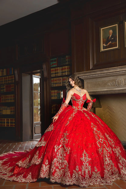 Front view of a woman wearing a red quinceañera dress with gold embroidery, corset bodice and structured skirt