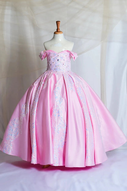Pink kid mini quince off the shoulder ball gown dress with 3d embroidery on a mannequin against a white background