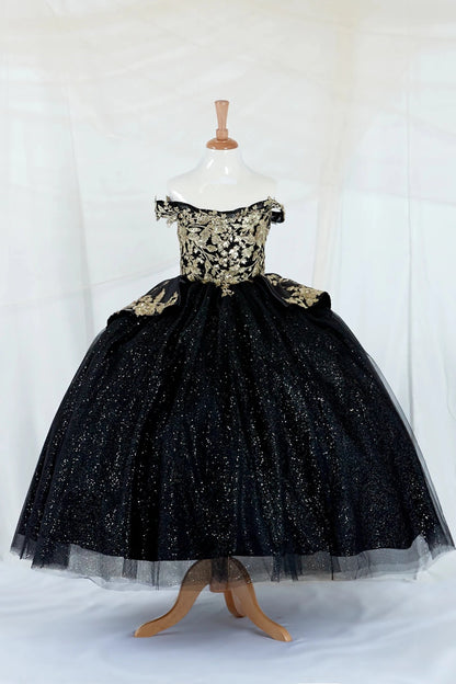 Black sparkly mini quince dress with 3d gold embroidery top on a mannequin against a white background