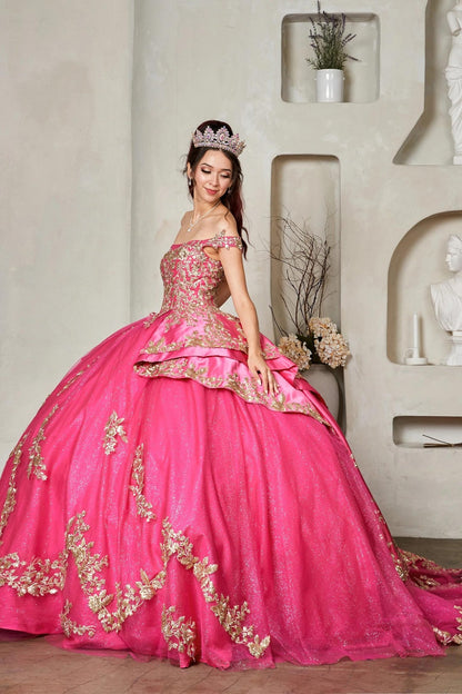 a voluminous fuchsia pink quince ball gown with ornate gold embroidery 