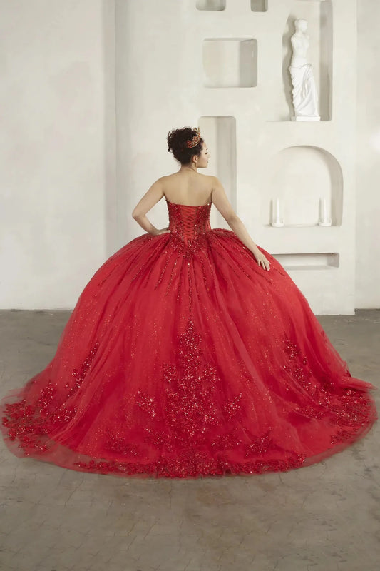 Back-Facing of a woman wearing Red formal gown featuring fitted bodice full skirt and flowing silhouette