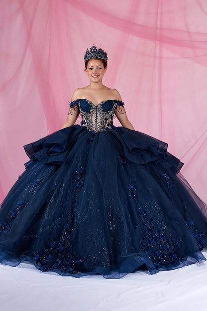 Navy quinceanera ball gown with off-shoulder neckline, bead accents, and glitter tulle skirt
