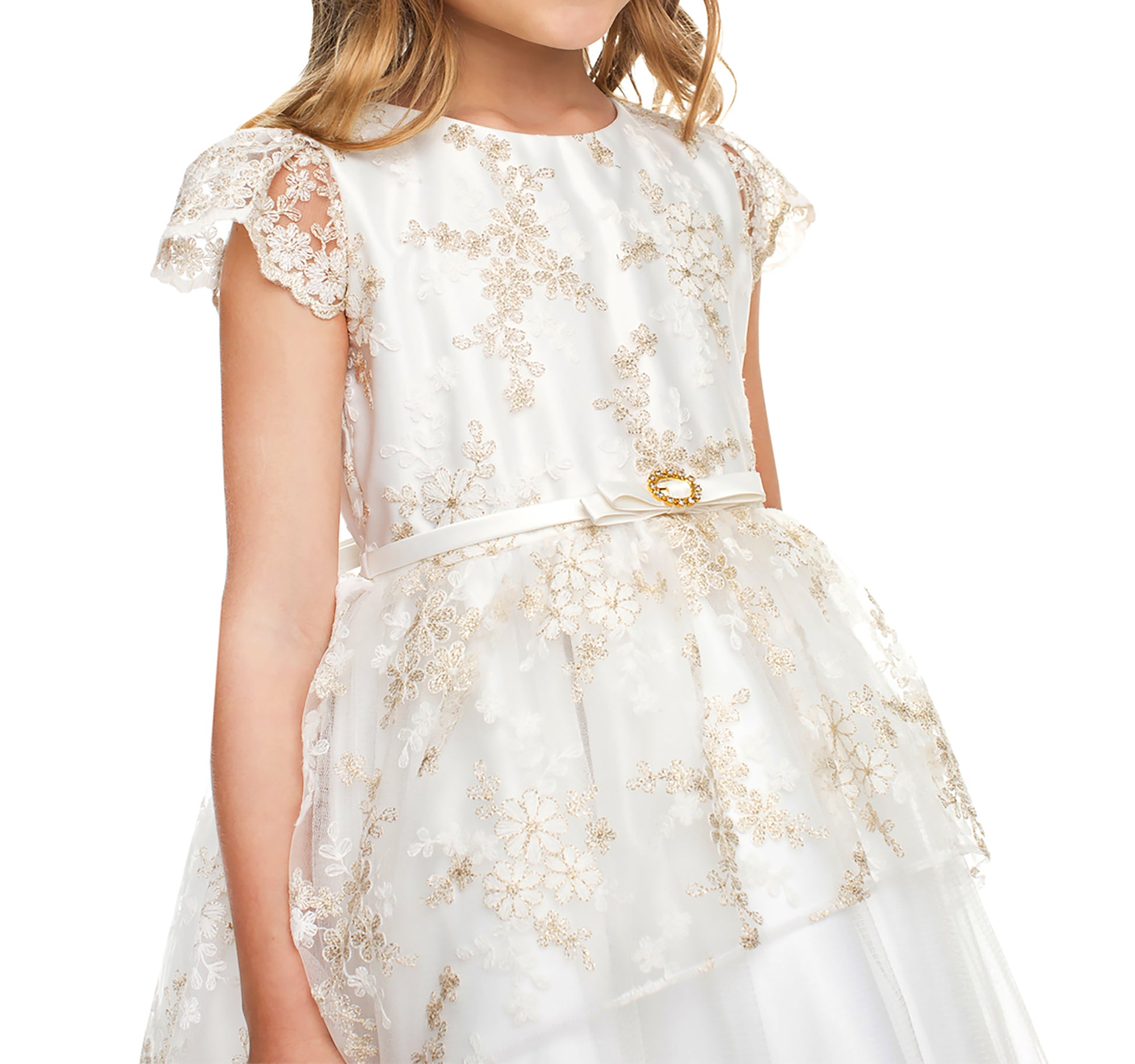 White dress with gold lace details on a white background