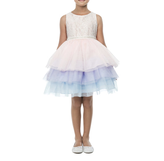Young girl wearing a white lace top and pastel multicolor skirt on a white background