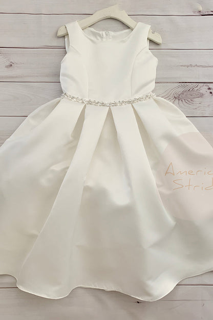 ivory satin dress with a rhinestone waistband on a wooden hanger
