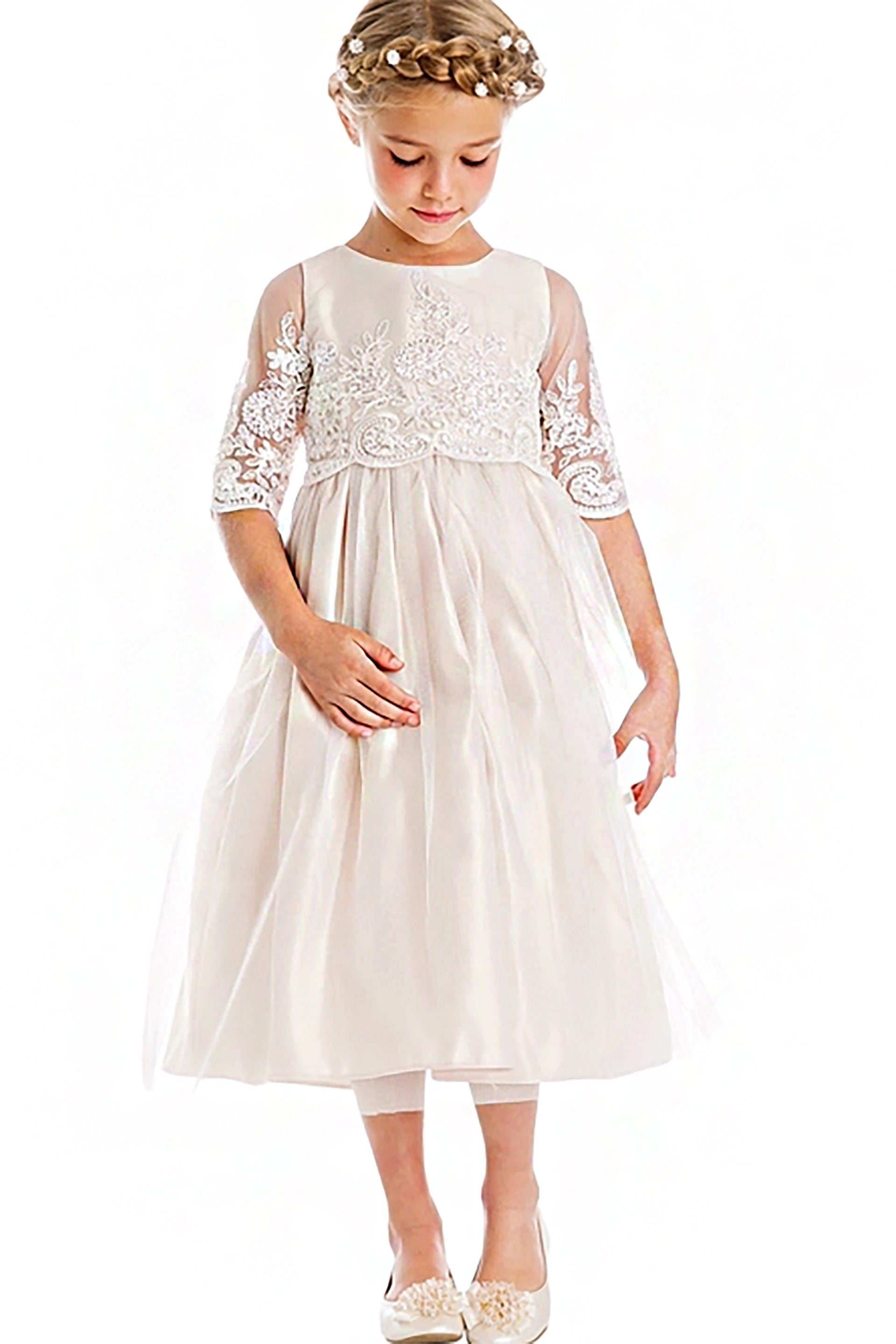 Young girl wearing a white lace long sleeve dress on a white background