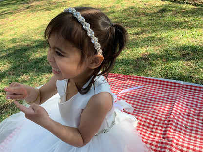 Handmade Rhinestone Flower Girl Headband - girl wearing headband smiling while sitting on picnic blanket