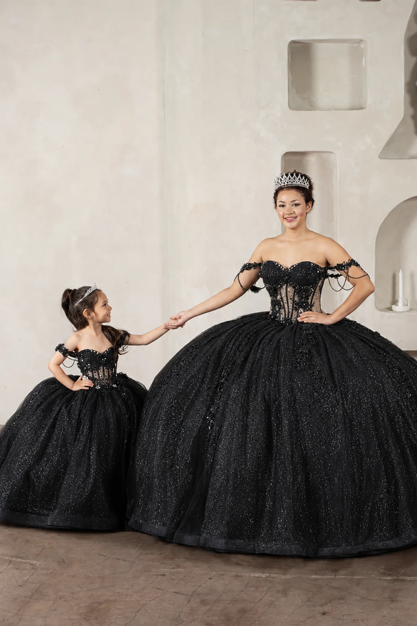 Black quinceañera ball gown with sheer corset bodice, 3D floral embroidery, detachable bow and sparkle tulle
