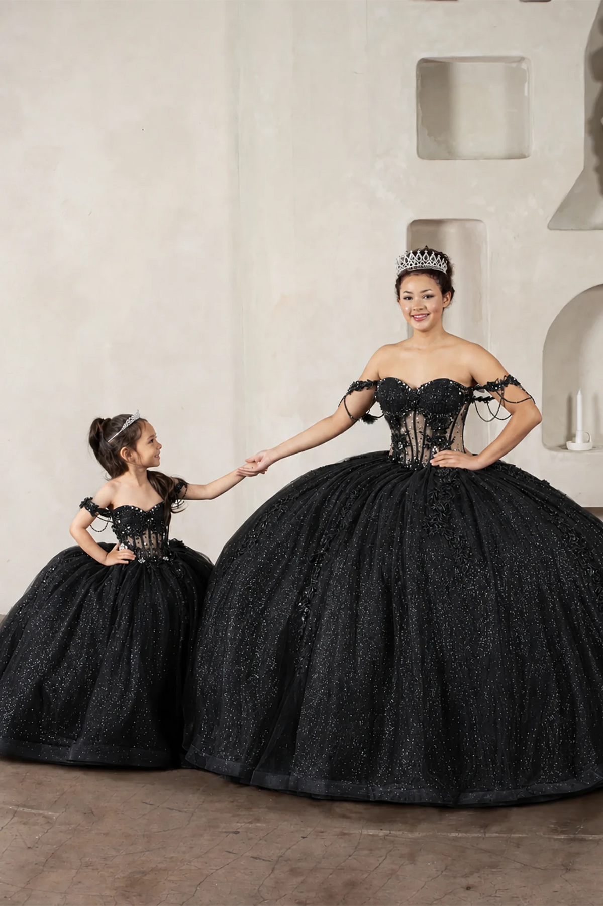 Black quinceañera ball gown with sheer corset bodice, 3D floral embroidery, detachable bow and sparkle tulle