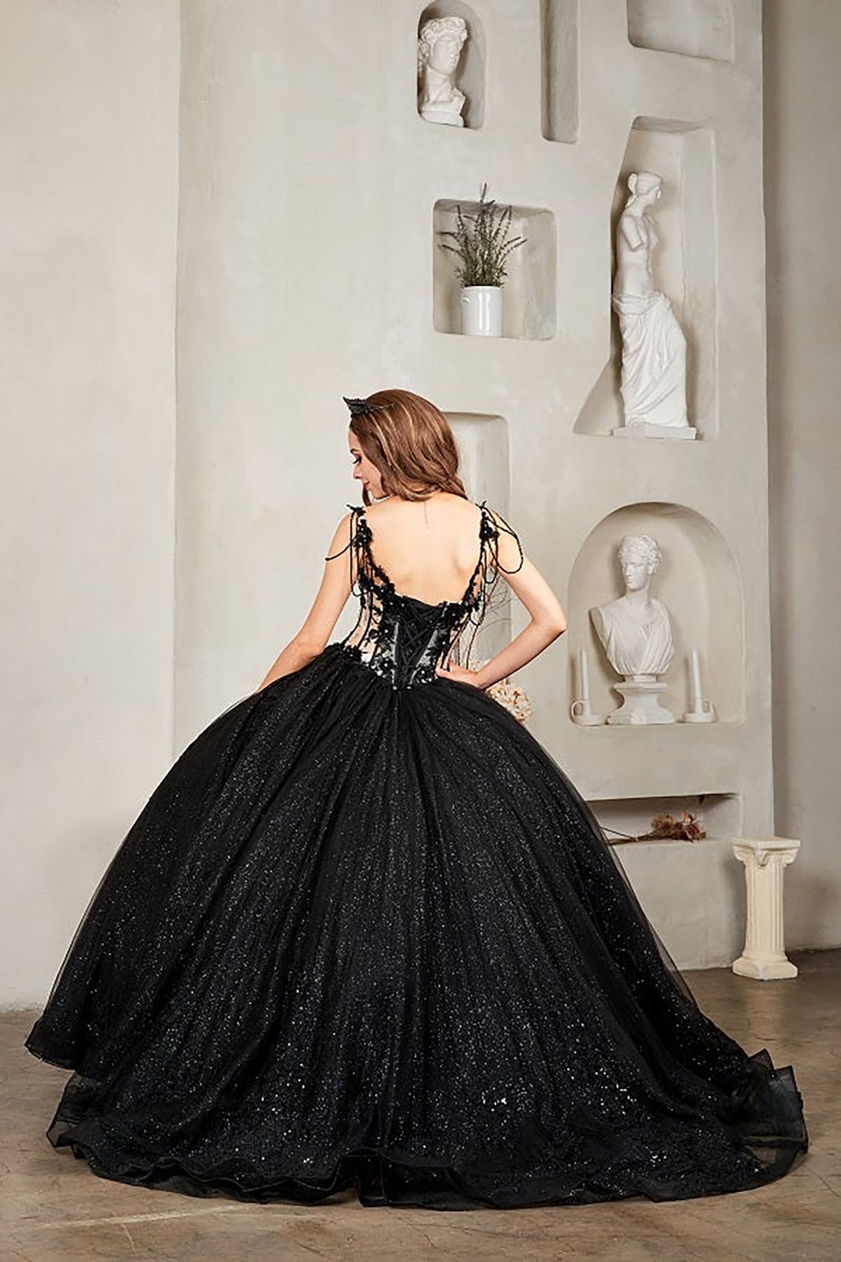 Black quinceañera ball gown with sheer corset bodice, 3D floral embroidery, detachable bow and sparkle tulle
