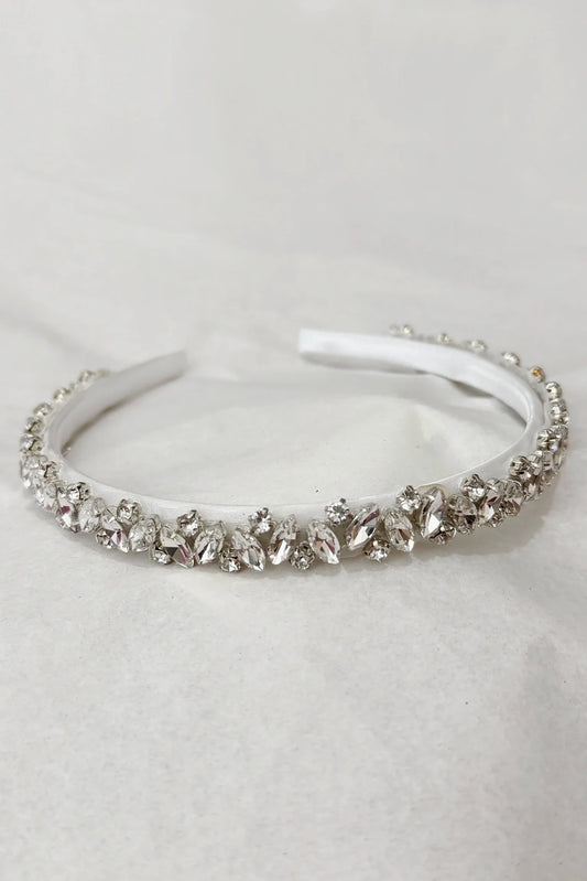 White handmade rhinestone flower girl headband with clear teardrop stones.
