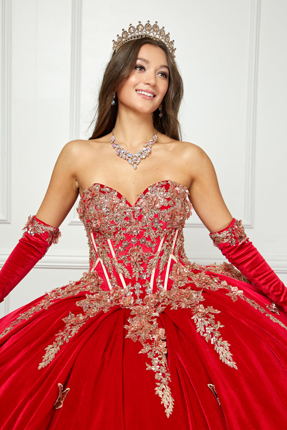 Red Quinceanera | Off-shoulder Velvet Sweetheart Gold Sequin sequin butterfly floral Ballgown with Sweep train - zoomed in front view of woman wearing dress and smiling