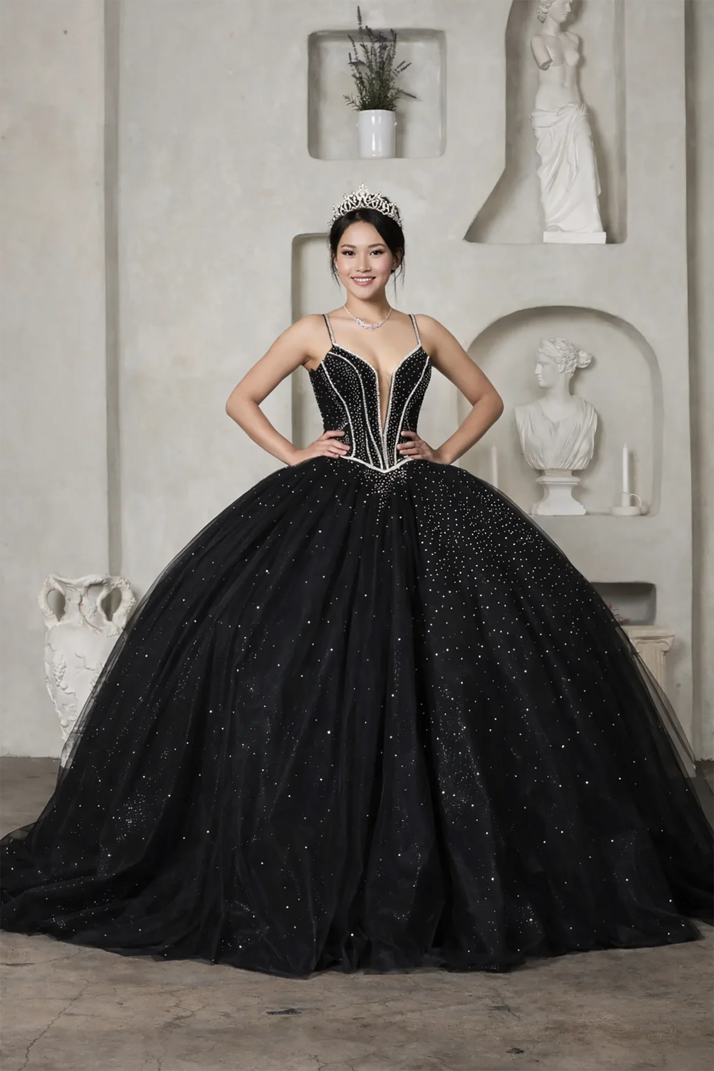 Woman wearing a black beaded quinceanera ball gown