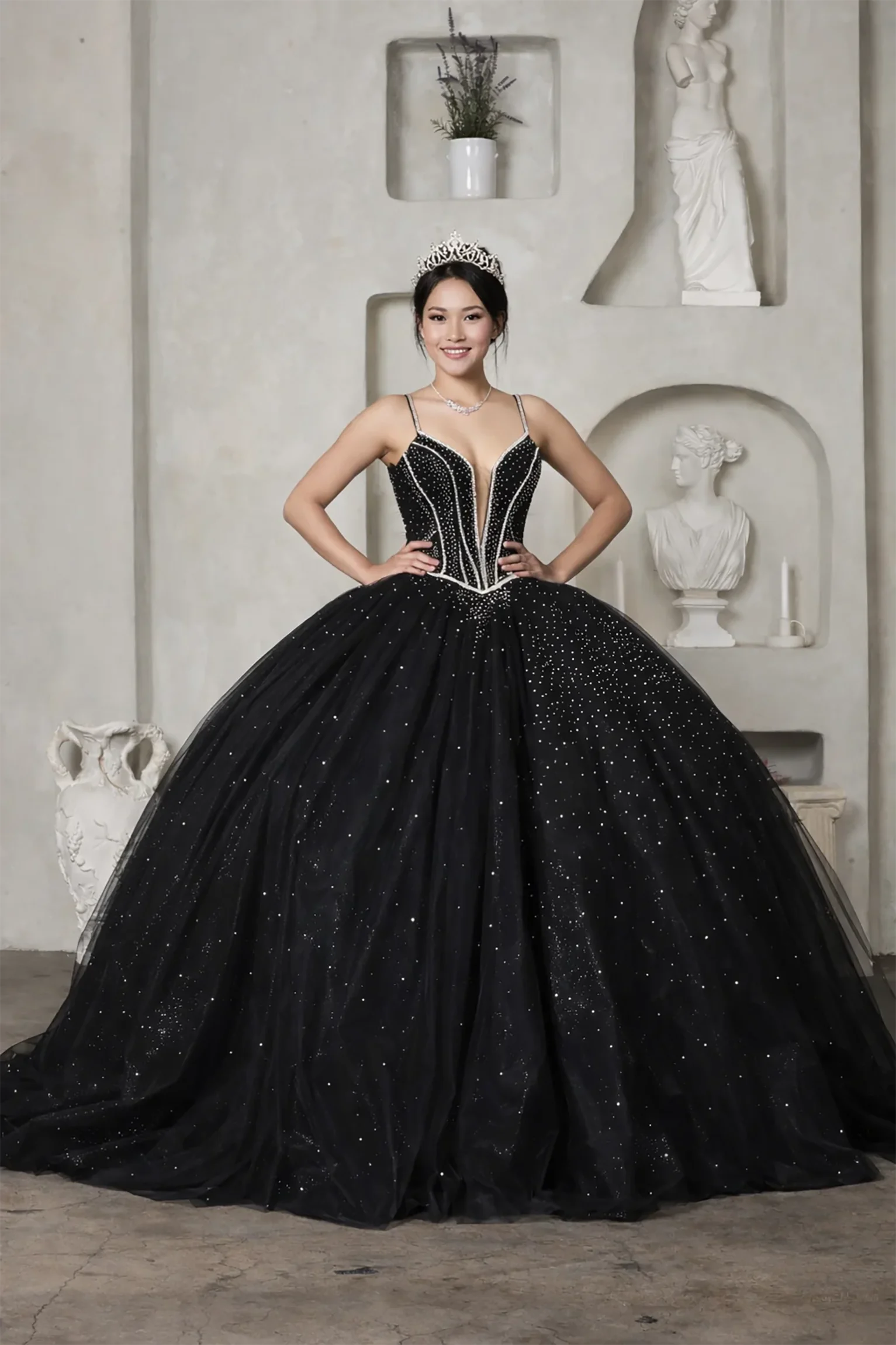 Woman wearing a black beaded quinceanera ball gown