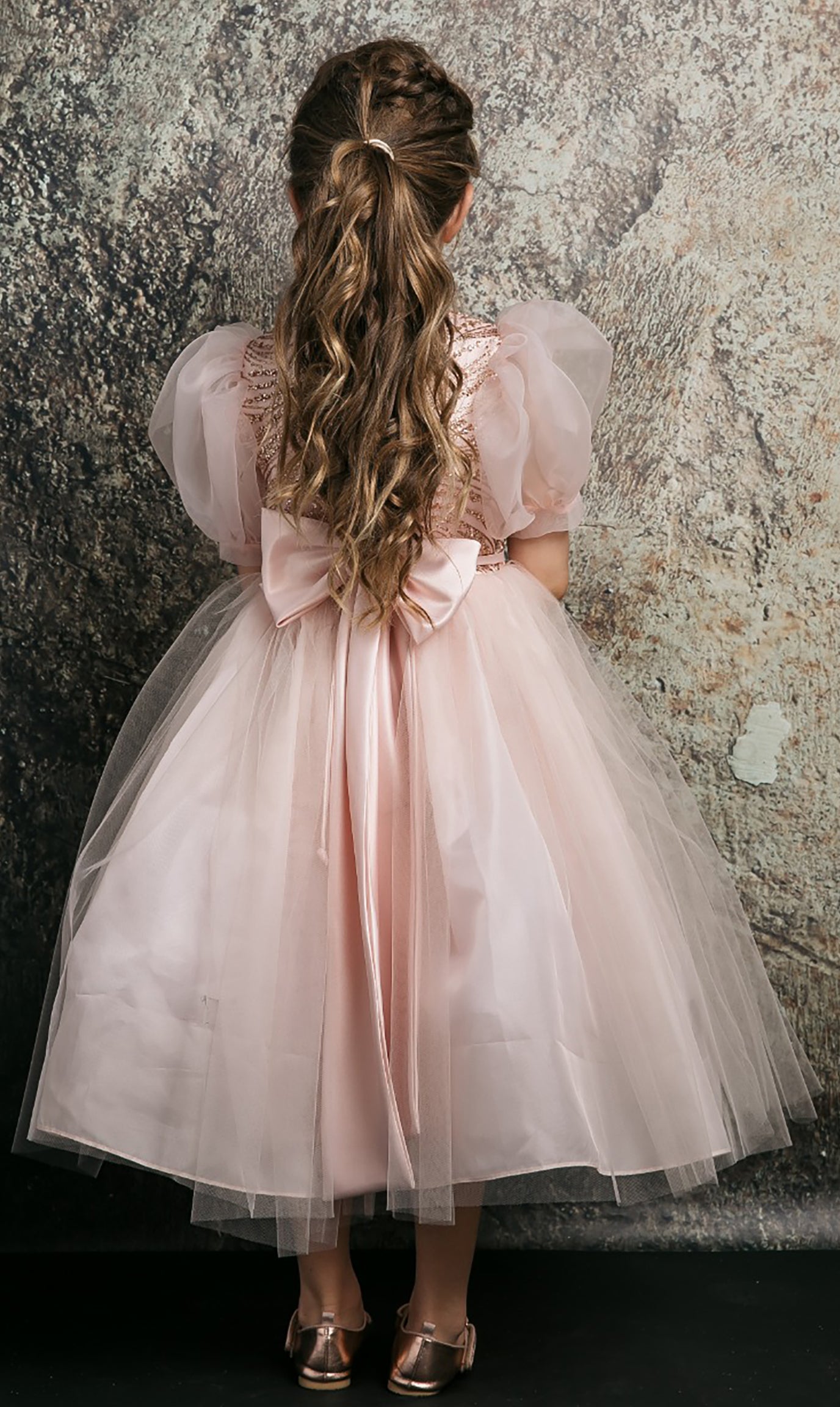 Blush USA Made | Glittering Sequin bodice Luxurious Tulle with Organza Bubble Sleeve Tea-length dress - back view of girl wearing dress with bow